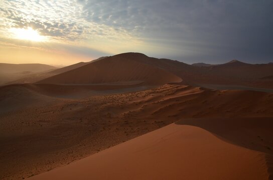 Walking on the dunes of Sossusvlei NP, Namibia © Christian