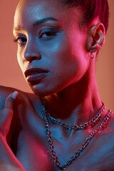 Portrait, makeup and closeup with a model black woman in studio on a neon background for beauty....