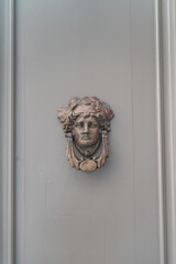 Closeup of ecorative doorknobs on wooden doors