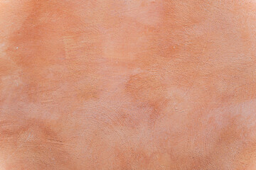 Terracotta orange texture of a wall in Italy