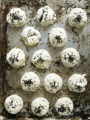 Fototapeta premium Row dough balls with black sesame seeds