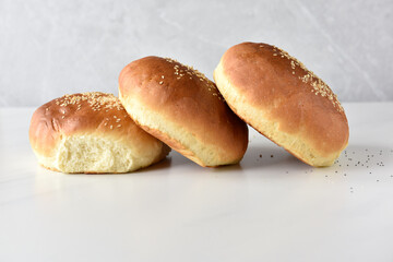 Baked buns bread with sesame and poppy