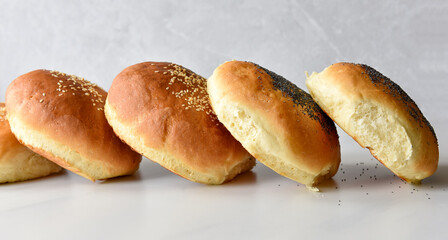 Baked buns bread with sesame and poppy