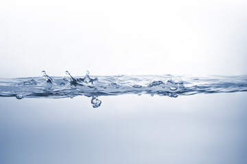 Water splash Aqua flowing in waves and creating bubbles Drops on the water surface feel fresh and clean isolated on white background.	