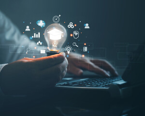 E-Learning Postgraduate Diploma Program Concepts. hand holding light bulb showing graduation cap...