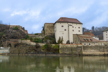 Fototapeta na wymiar Niederhaus Castle in Passau, Germany, on a rocky promontory where the Danube and Ilz meet