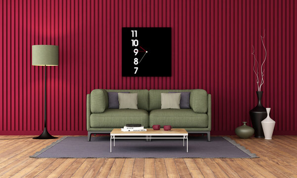 Green sofa in fronta a wall with viva magenta panels