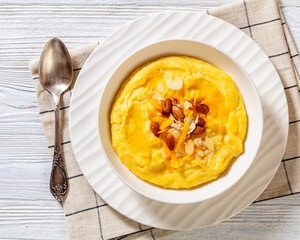 corn grits with butter, vegan cheese, and almonds