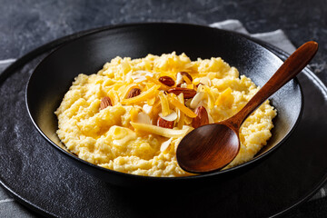 corn grits with butter, vegan cheese, and almonds