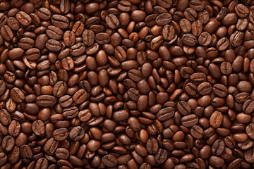 Top view macro photography shot of a bucket full of roasted coffee beans