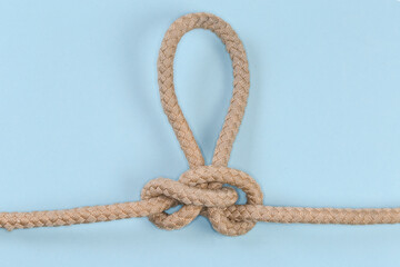 Rope knot Butterfly loop on a blue background