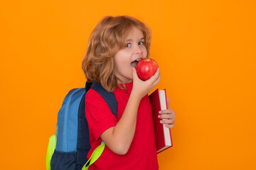 School children. School child student eat aplle, study english language at school. Elementary school child.
