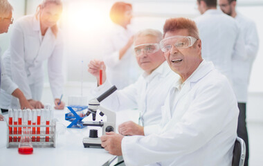 group of scientists analyzing the results of tests.