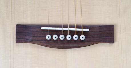 Musical instrument - Closeup top view bridge acoustic guitar