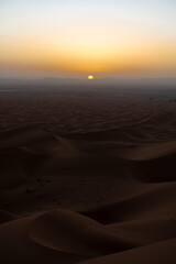 sunset in the desert dunes