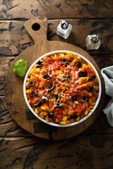 Homemade pasta bake with olives and tomato