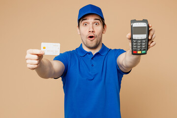 Delivery guy amazed employee man wear blue cap t-shirt uniform workwear work as dealer courier hold...