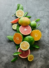 Fototapeta na wymiar Assorted ripe citrus fruits on table