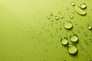 Green wet waterproof impregnated fabric - obrazy, fototapety, plakaty