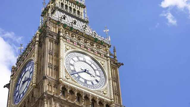 Big Ben tower clock, Palace of Westminster, Houses of Parliament in London. Famous English tourism destination, iconic landmark, travel in England. 4k slow motion.