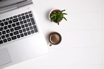 Laptop on table, top view, copy space