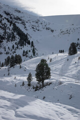 Ski in winter season, mountains and ski touring on the top of snowy mountains in Tirol, Austria.