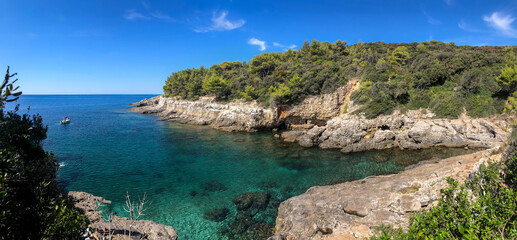 Obraz premium Panorama View of Turquoise Adriatic Sea at Pula. Summer Sunny Day Scenery with Crystal Clear Water with Rocky Shore in Croatia.