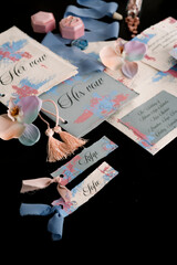 close up wedding stationery on black isolated background