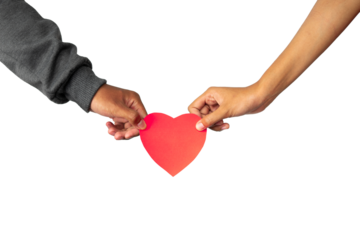 two hands holding heart. couple holding red love shape
