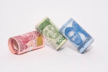 Closeup New naira notes 1000, 500 and 200 banknotes on a white background laying and falling over each 