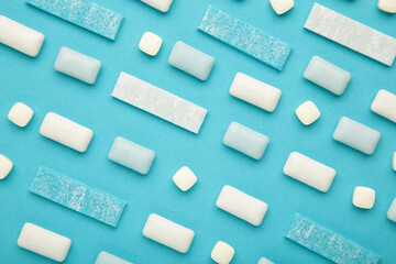 Pads of chewing gum on blue background. Fresh mint bubble gum.