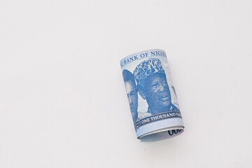 roll of 1000 Nigeria new Naira note isolated on white background