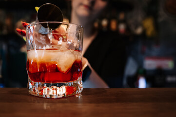 woman hand bartender making negroni cocktail