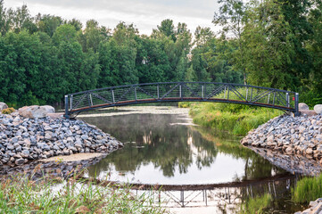 Fototapeta na wymiar Bridge in the park. Nykarleby/Uusikaarlepyy, Finland