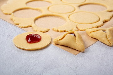 Dough, Jam, Sugar, Butter, Rolling Pin on Gray Stone Table. Purim Celebration, Jewish Carnival Holiday Concept.