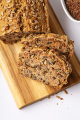 Homemade Gluten Free Bread. Healthy Eating Concept. Millet, buckwheat, psyllium husks, flax seeds on Gray Table.