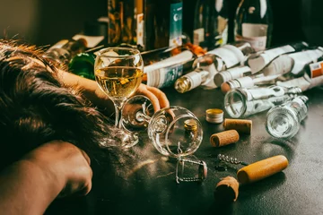 Tuinposter After party - empty bottles, concept of alcoholism, alcohol abuse and addiction © Brebca