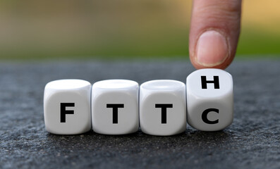 Hand turns dice and changes the expression Fiber to the curb (FTTC) to Fiber to the home (FTTH). Symbol for connecting residences directly with optical fibers.