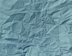 Fototapeta premium Abstract wrinkled or Free photo crumpled Modern crumpled blue paper or blue empty canvas on empty sheet for card, book cover, wallpaper, and any design.