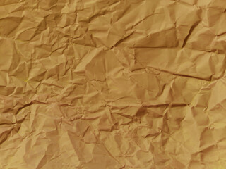 Obraz premium Abstract wrinkled or Free photo crumpled brown paperboard or empty canvas or paper surface with folded stains. 