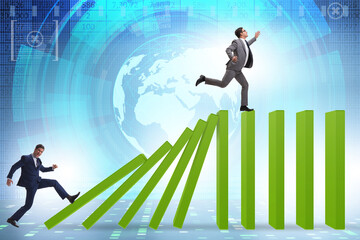 Businessman in domino effect concept