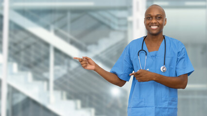 Black doctor or male nurse pointing sideways