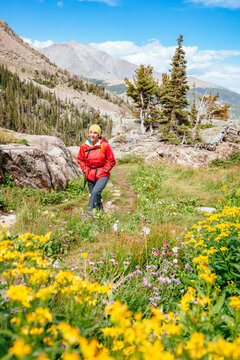 Female Hiker Hiking On Bluebird Lake Trail In Rocky Mountain National Park, Colorado, Usa