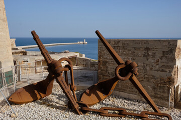 large anchors in the coast in the port area near the Valletta district in Malta.