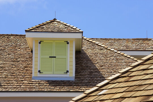 A building in Bahamas with colorful dormers.