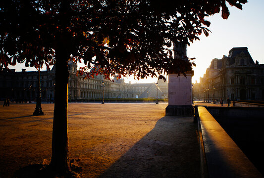 Exterior of Louvre Museum with Pyramid Entrance in distance