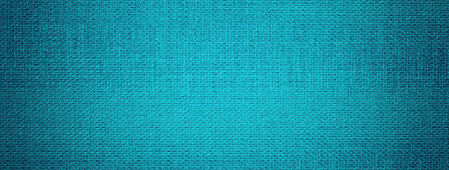Dark blue background from textile material with wicker pattern, and vignette. Turquoise fabric with...