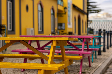 Aligned colorful wooden tables