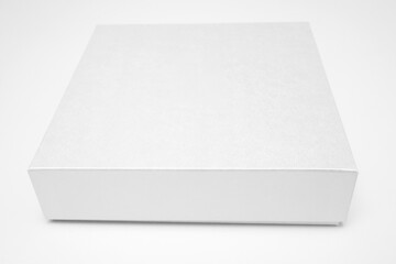 Fototapeta premium White textured box, gift mockup on white background.High resolution photo. Blank White Product Package Box Mock-up. Container, Packaging Template on white. Cardboard box.