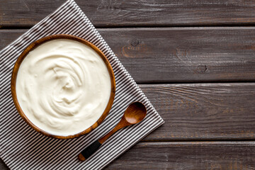 Bowl of sour cream or yogurt. Dairy product background